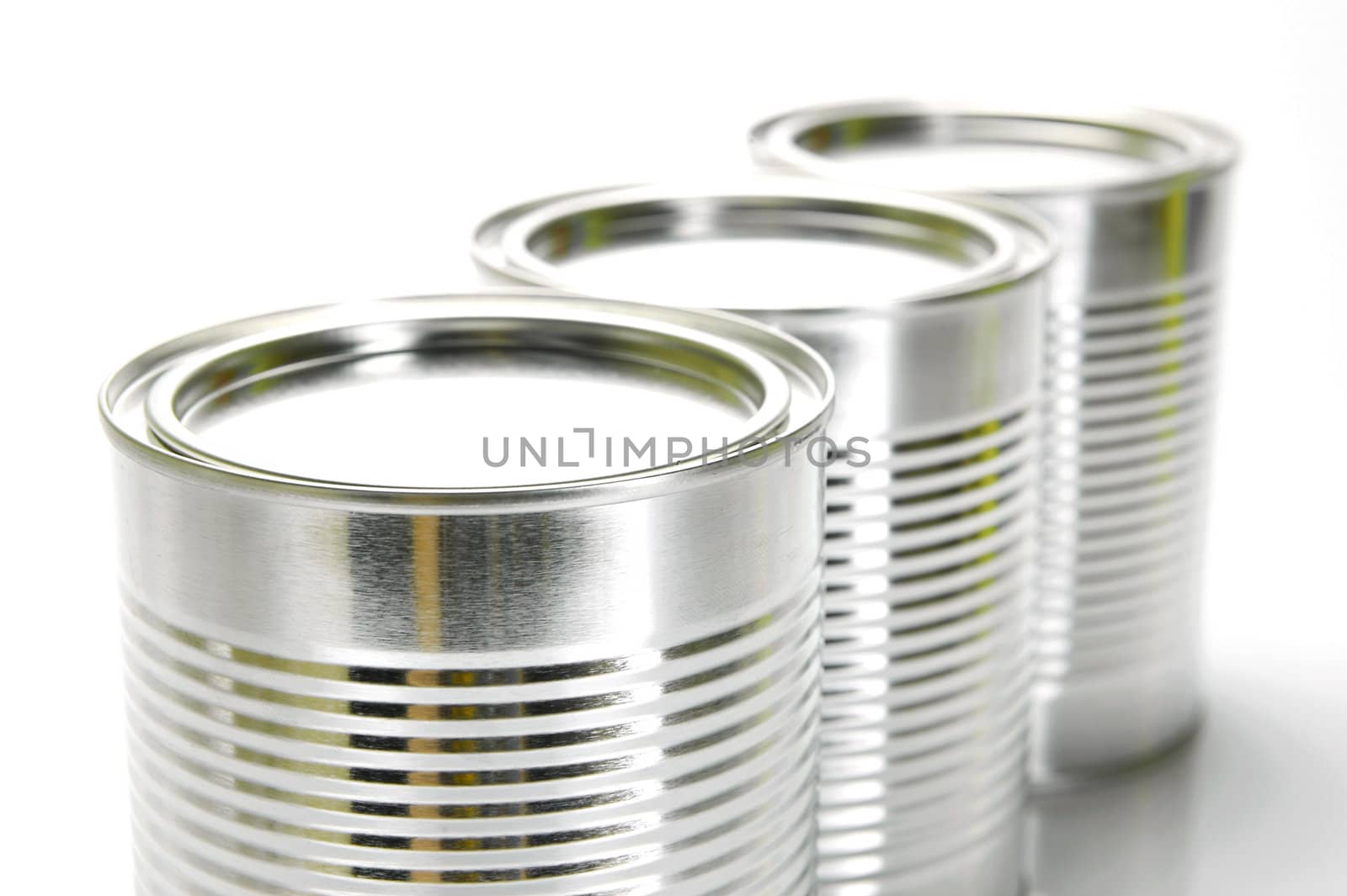 Tin cannisters isolated against a white background