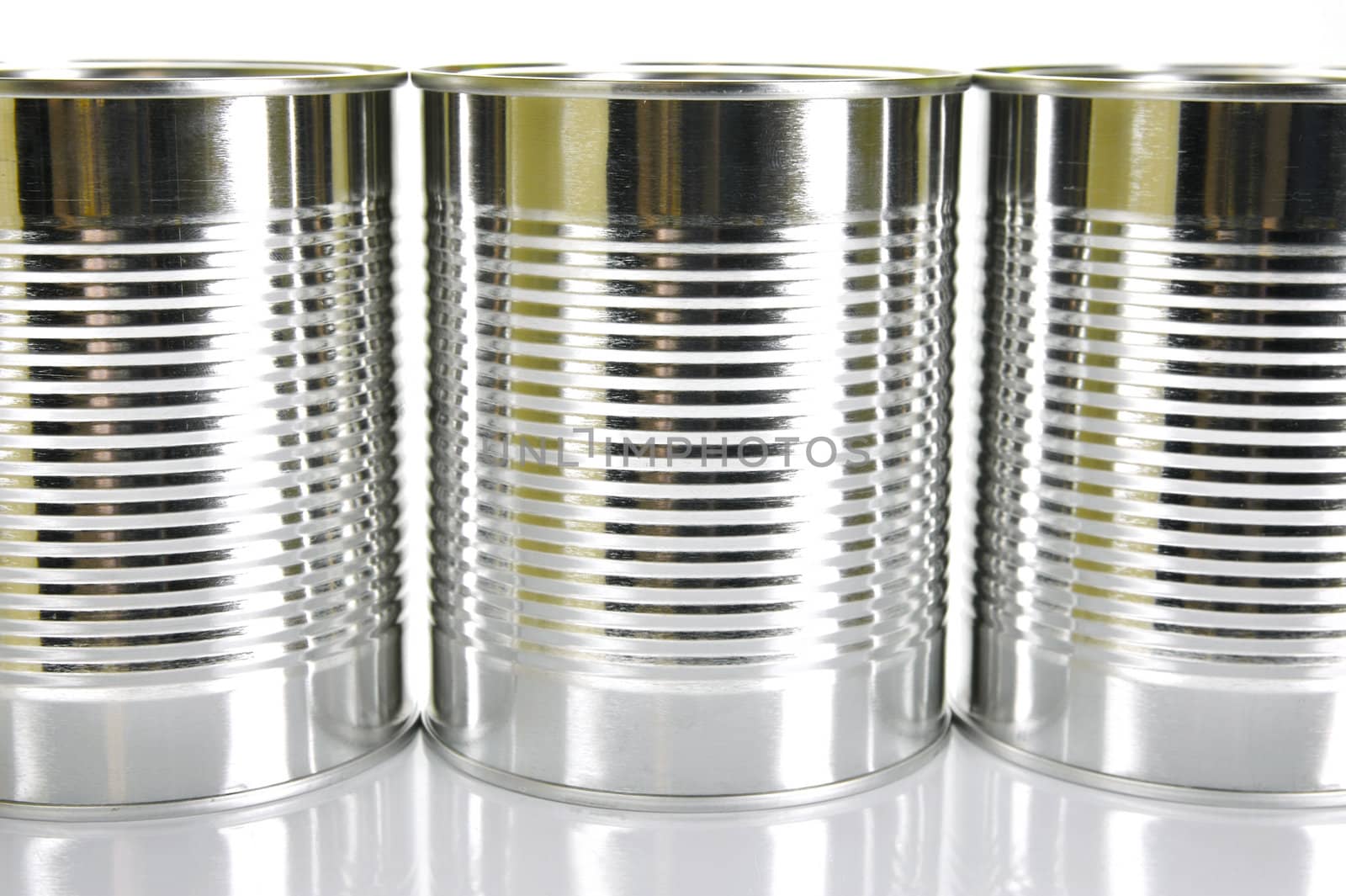 Tin cannisters isolated against a white background