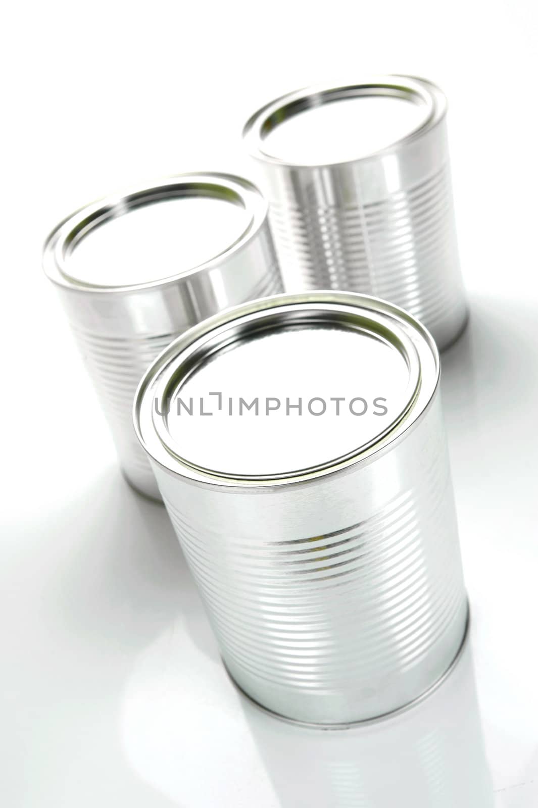 Tin cannisters isolated against a white background
