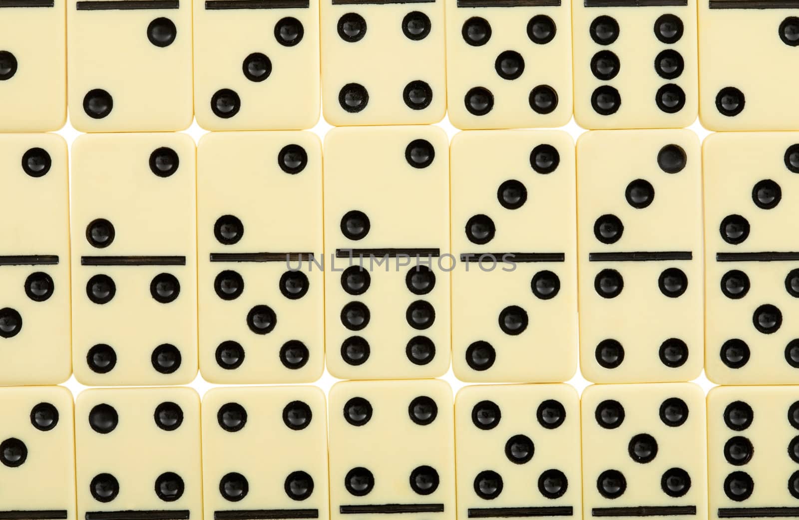Background from white spotted dominoes pieces