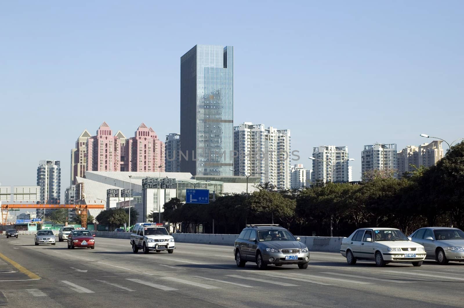 China, Shenzhen city - general cityscape with modern office building, residential buildings and street.