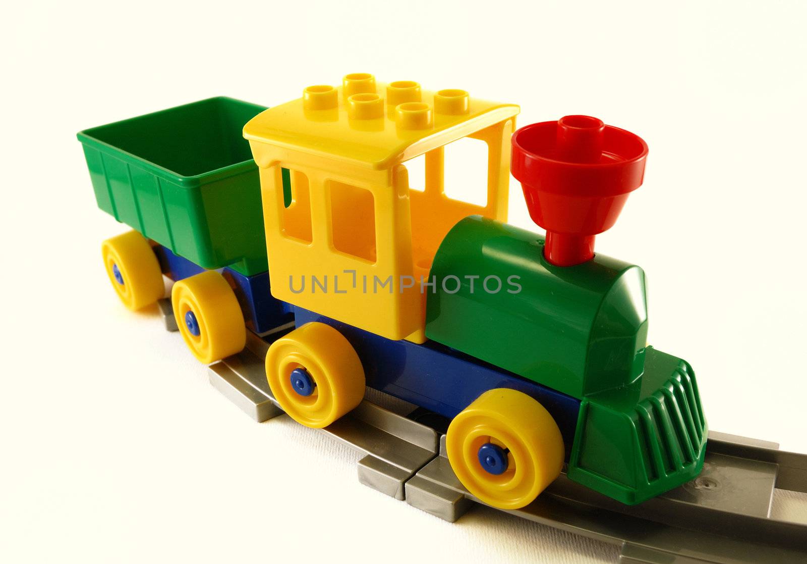 toy train made with building blocks on railway