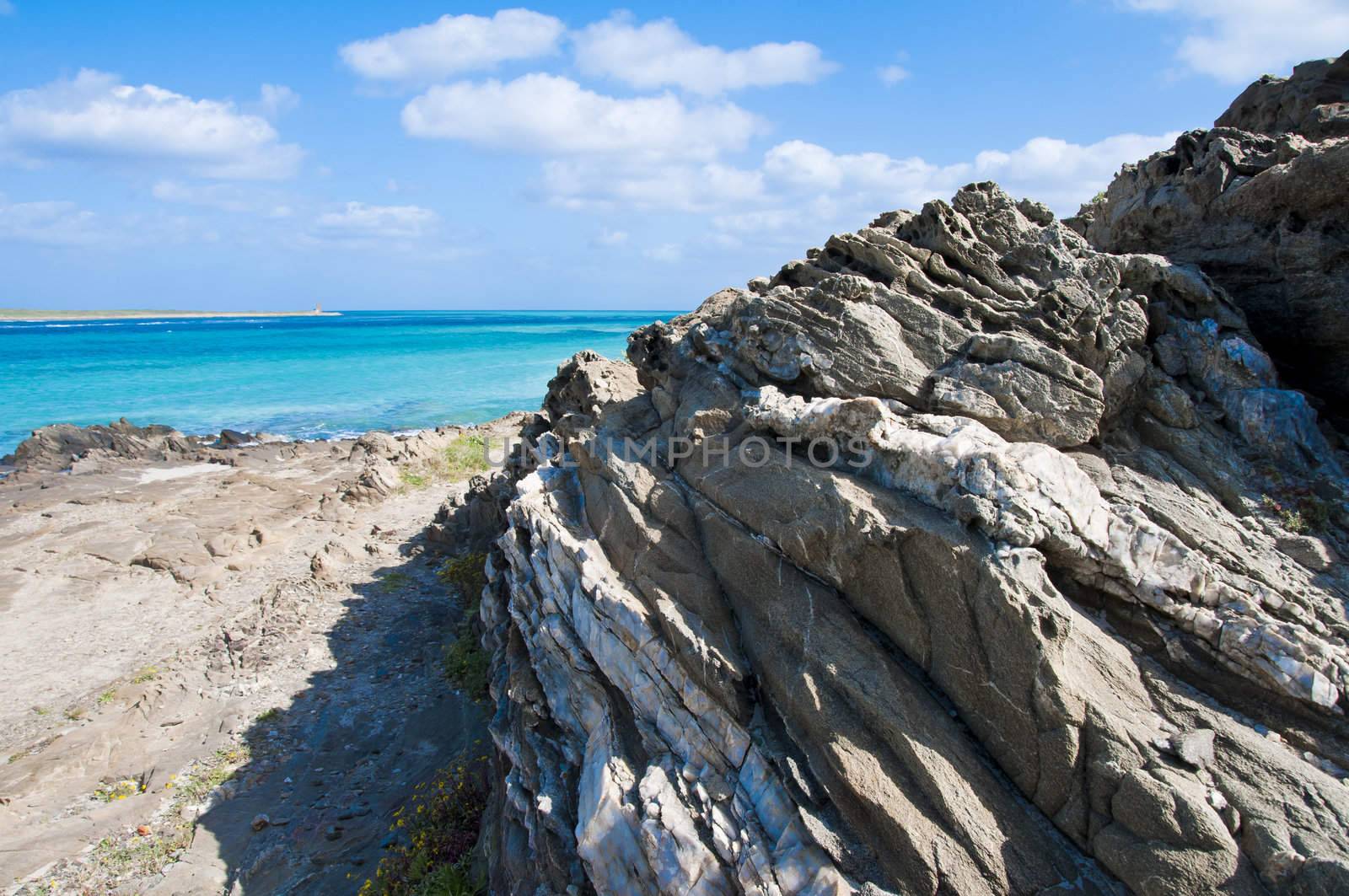 rocks on the beach of Stintino in Sardinia by peus