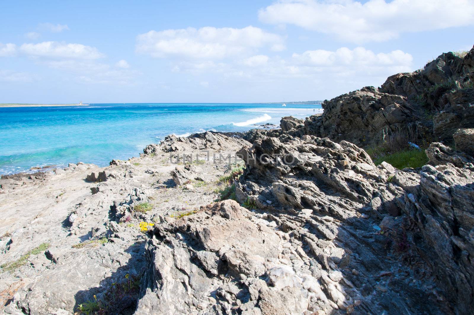 rocks on the beach of Stintino in Sardinia by peus