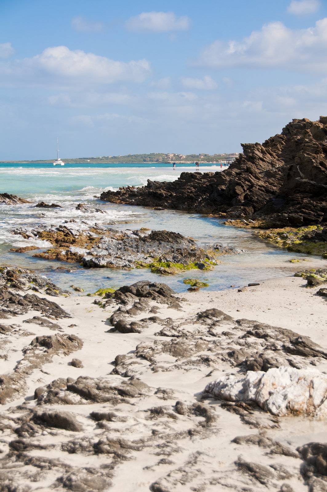 rocks on the beach of Stintino in Sardinia by peus