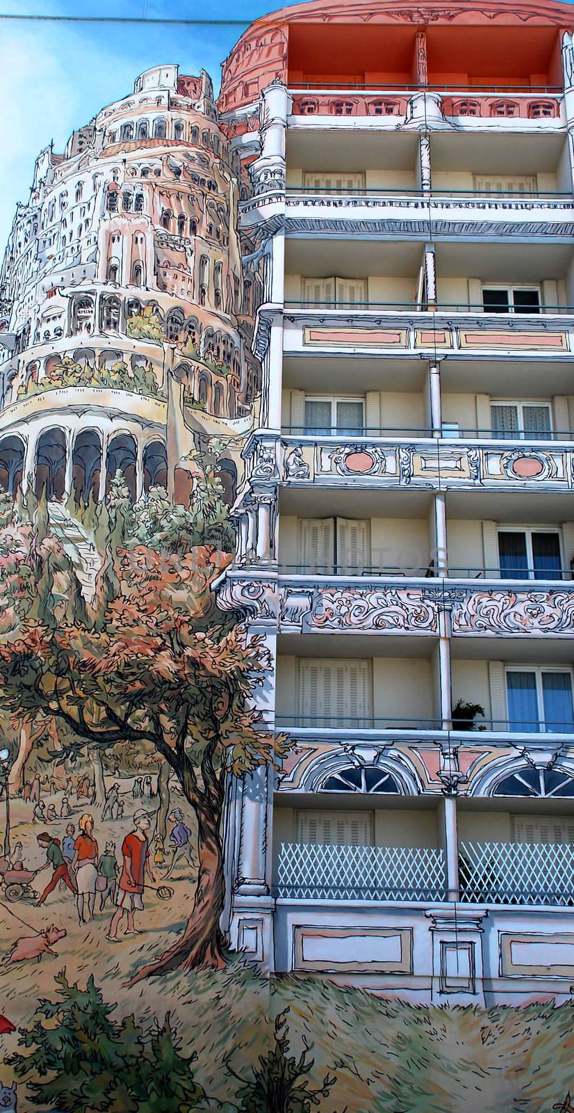 One of the many painted buildings in Lyon, in France. Indeed in Lyon there are many buildings painted like this with many different drawings. They paint this like a normal picture but on the walls of big buildings. In this one It is represented many things but we can see the tower of Pise in Italy.