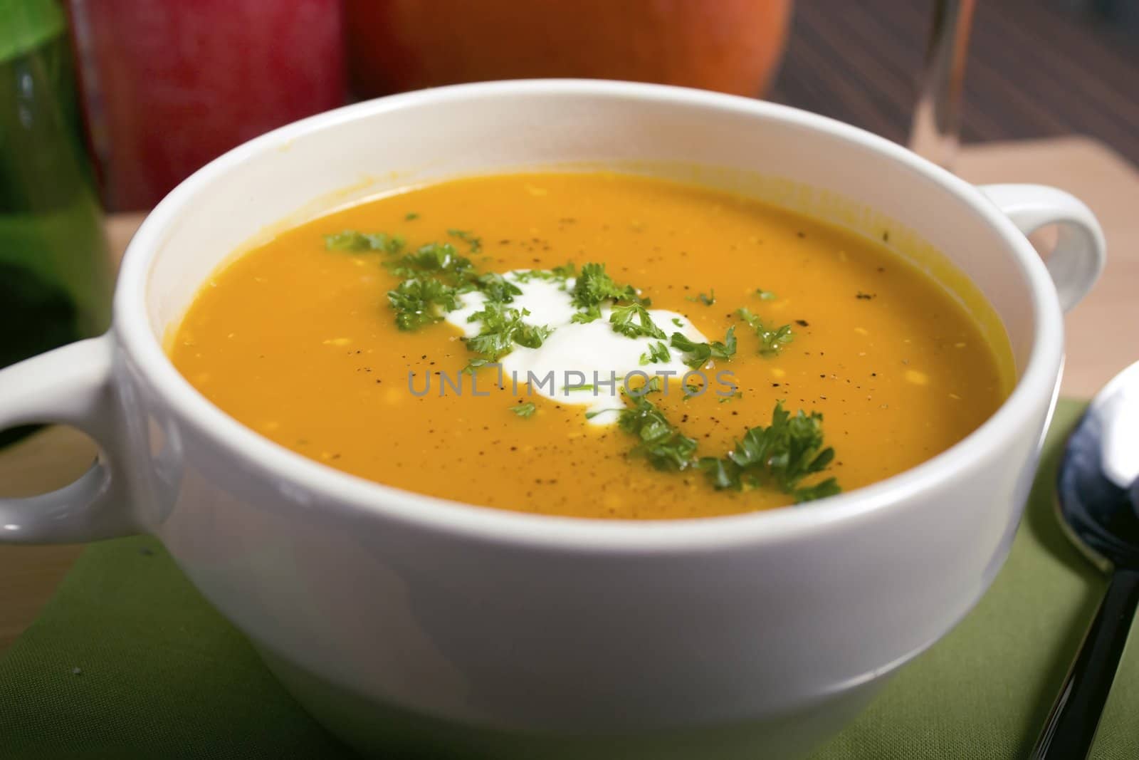 Close up of bowl of pumpkin soup.  