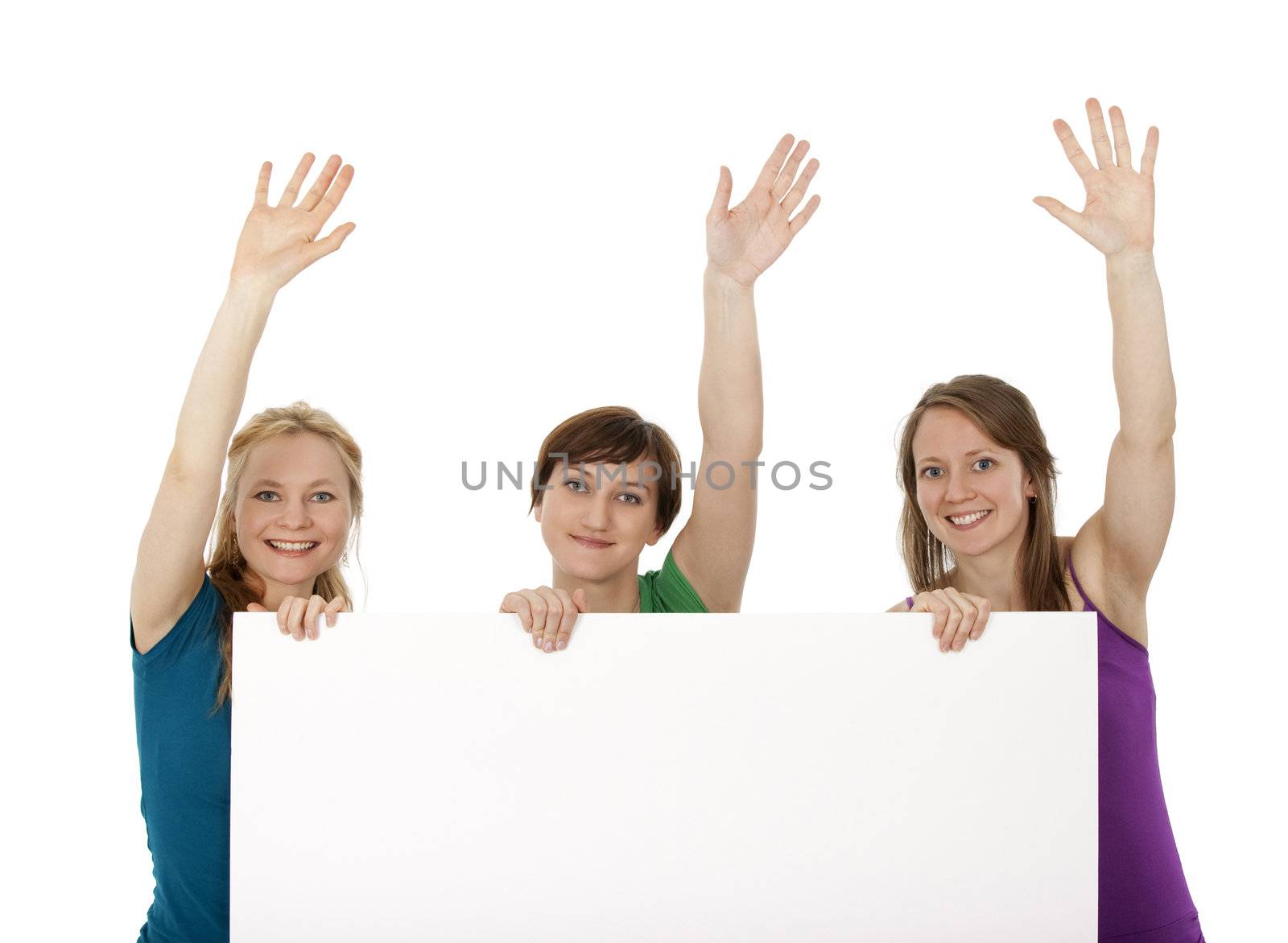 Three young women holding a banner and greeting by anikasalsera