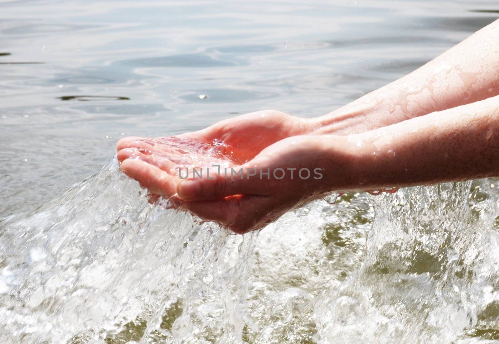 hand and splashing cold drink water showing nature concept