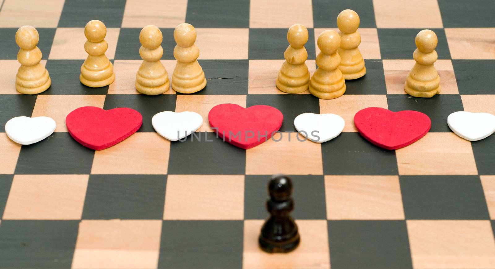 Conceptual image of a man in love with an assortment of women, using chess pieces to convey the concept