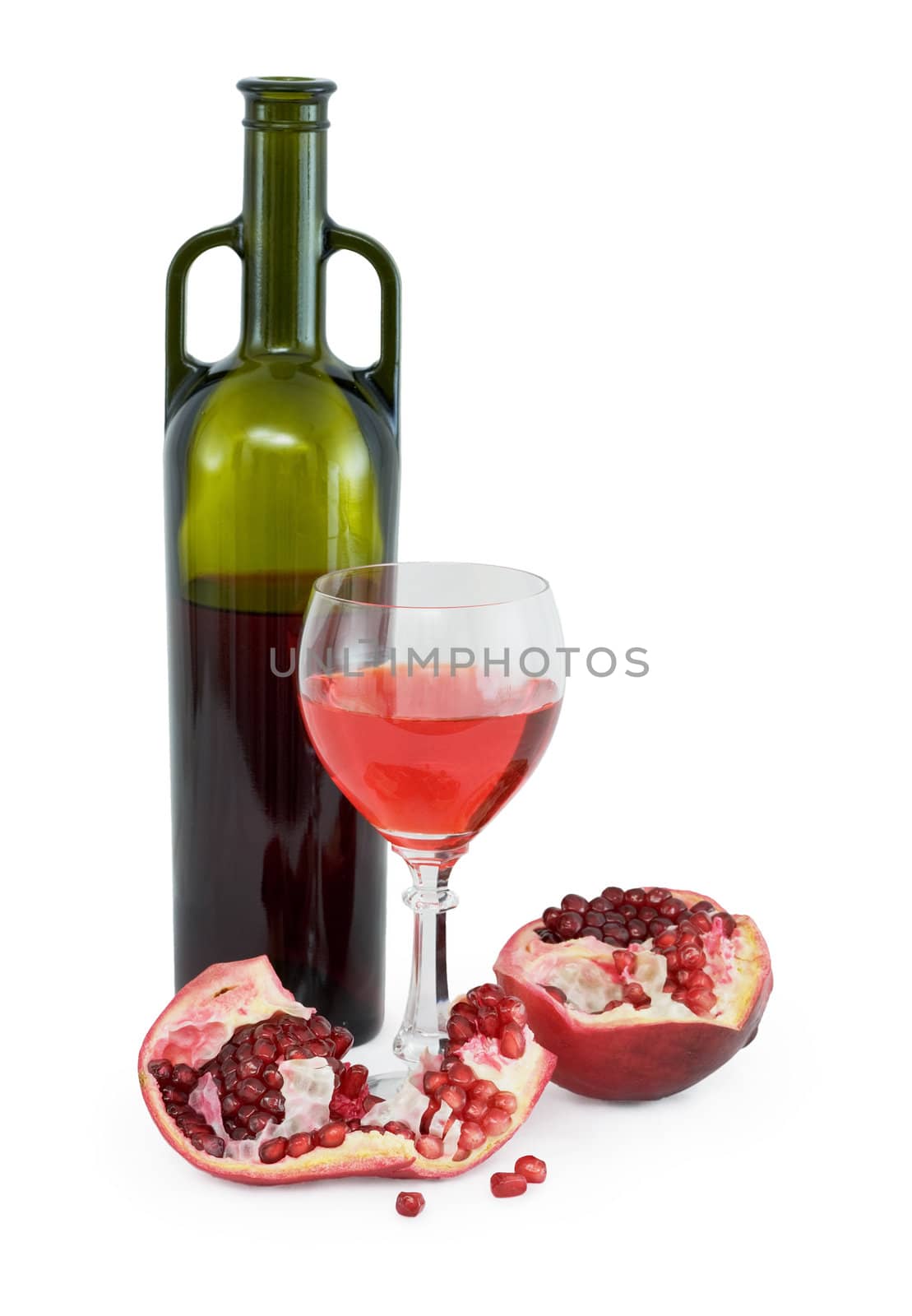 Still-life with a glass of wine, bottle and a red pomegranate