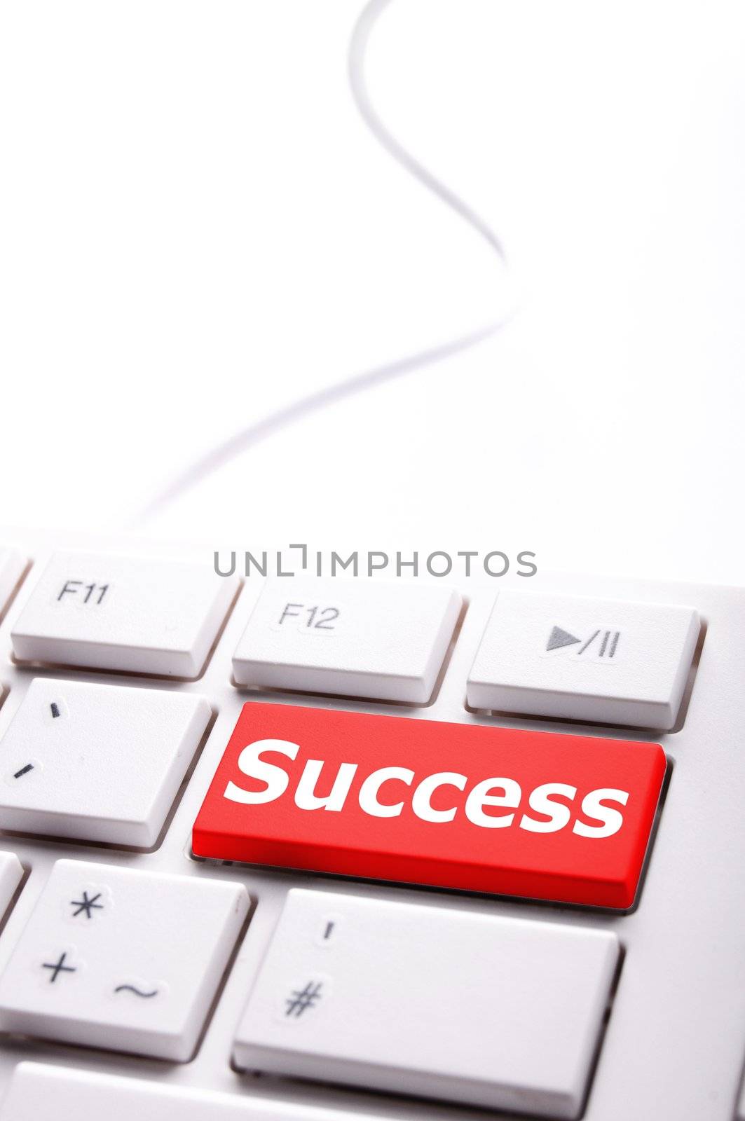 success in business concept with key on computer keyboard