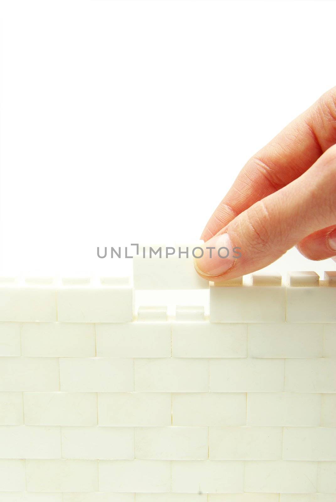 compleeting the wall on a white background