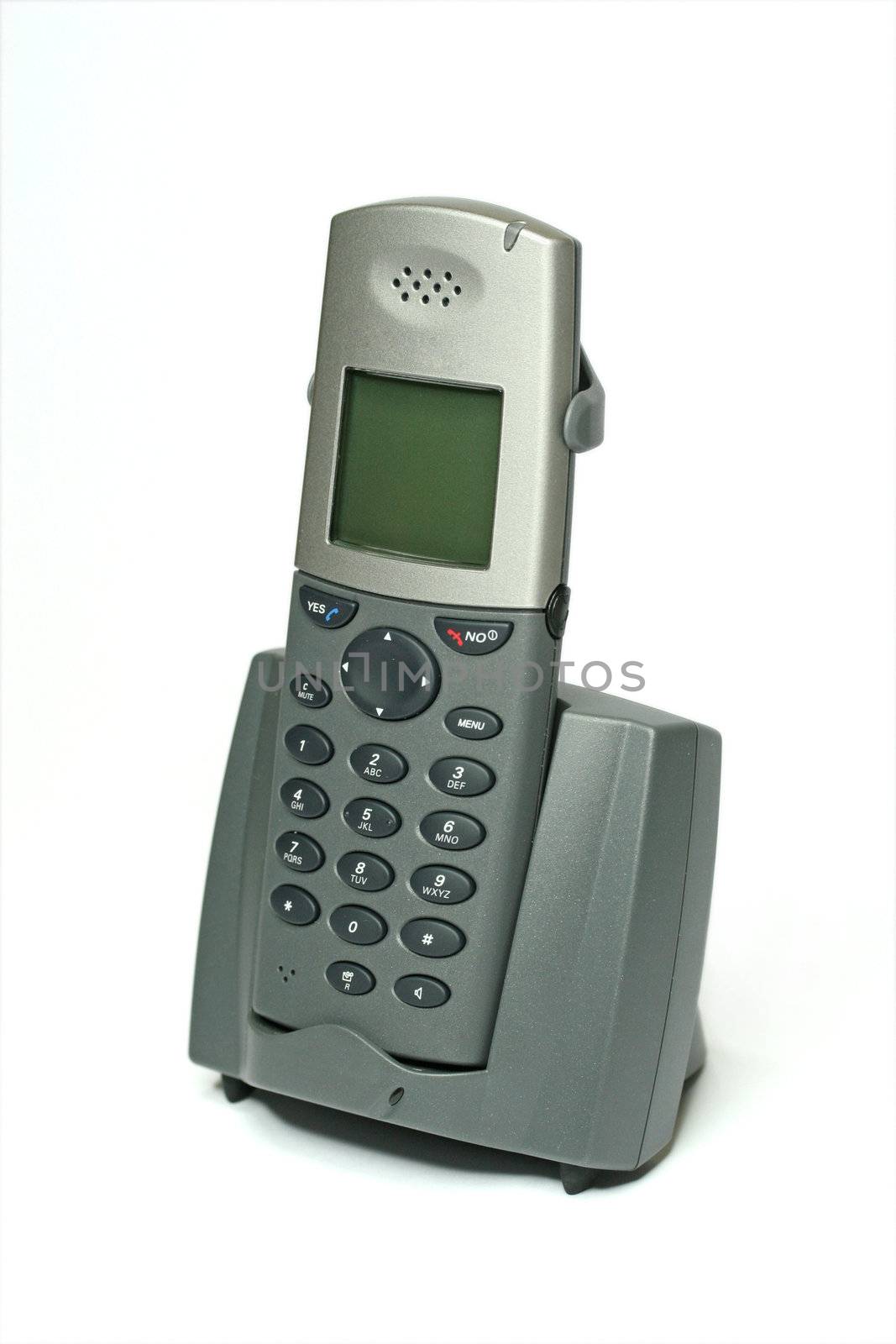 cordless phone on a cradle/charger on white background