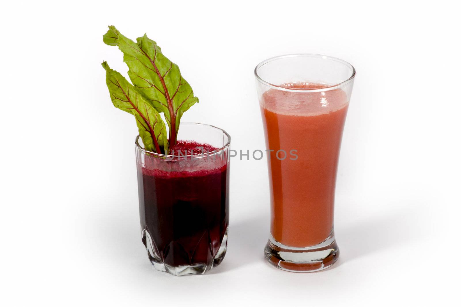 Fresh carrot juice and beetroot juice isolated white background