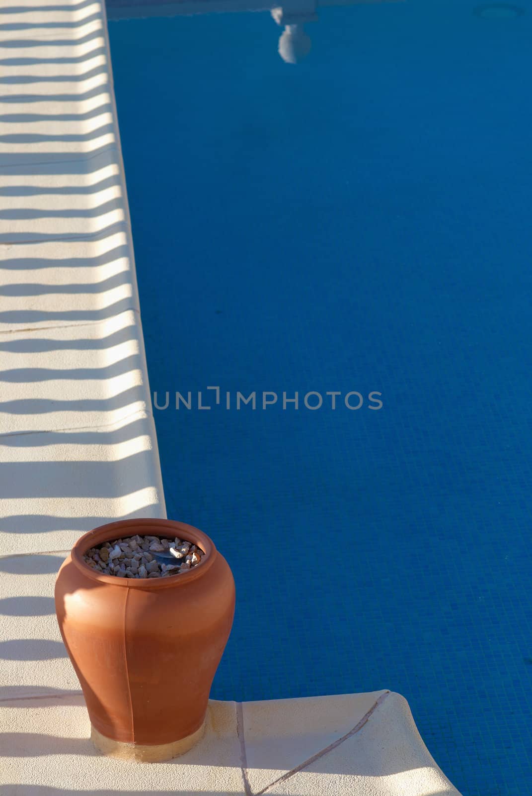 Detail take of  a swimming pool with the reflection of its balustrade