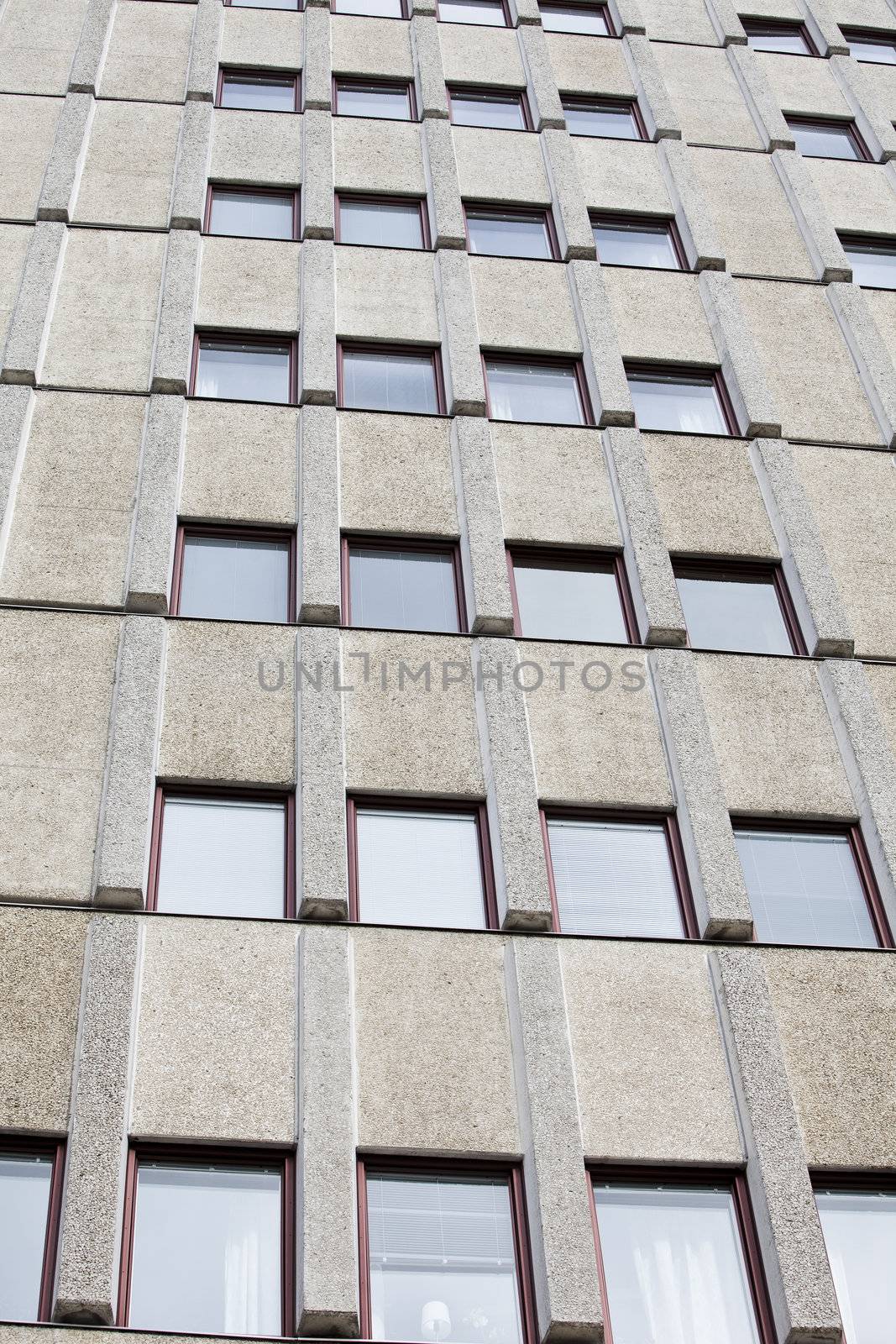 Several windows on a worn building