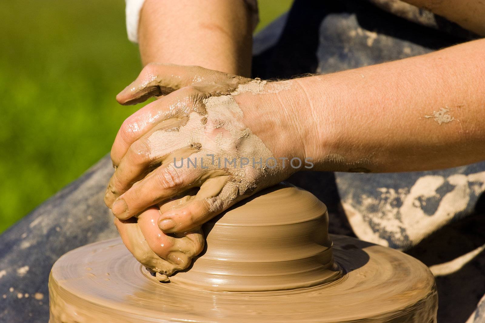 Potters hands starting to make new ceramic object