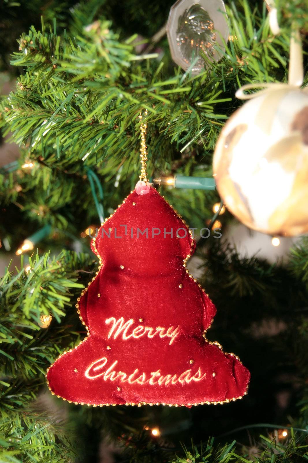 a christmas tree decoration hanging from the tree