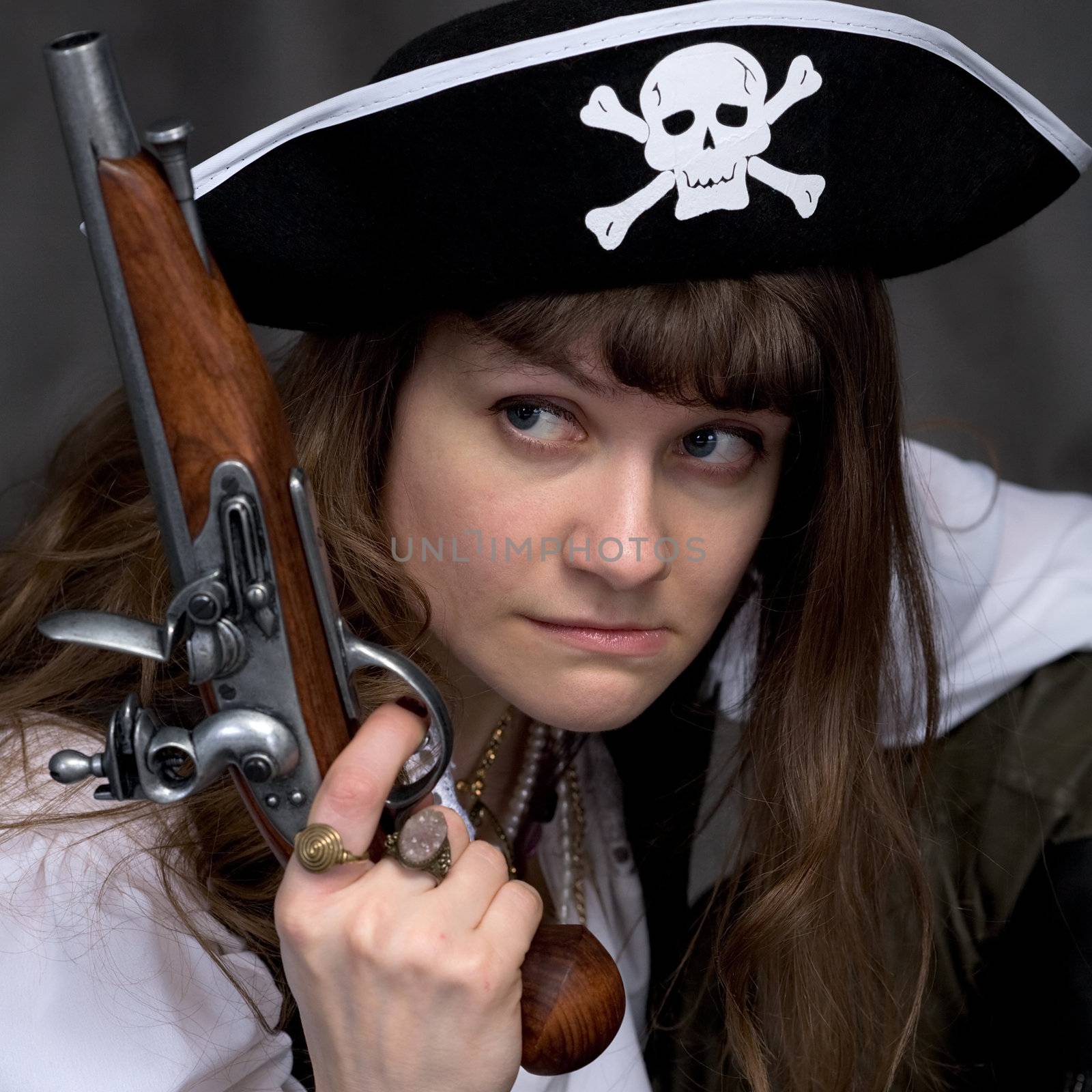 Girl - pirate on black with pistol in hand