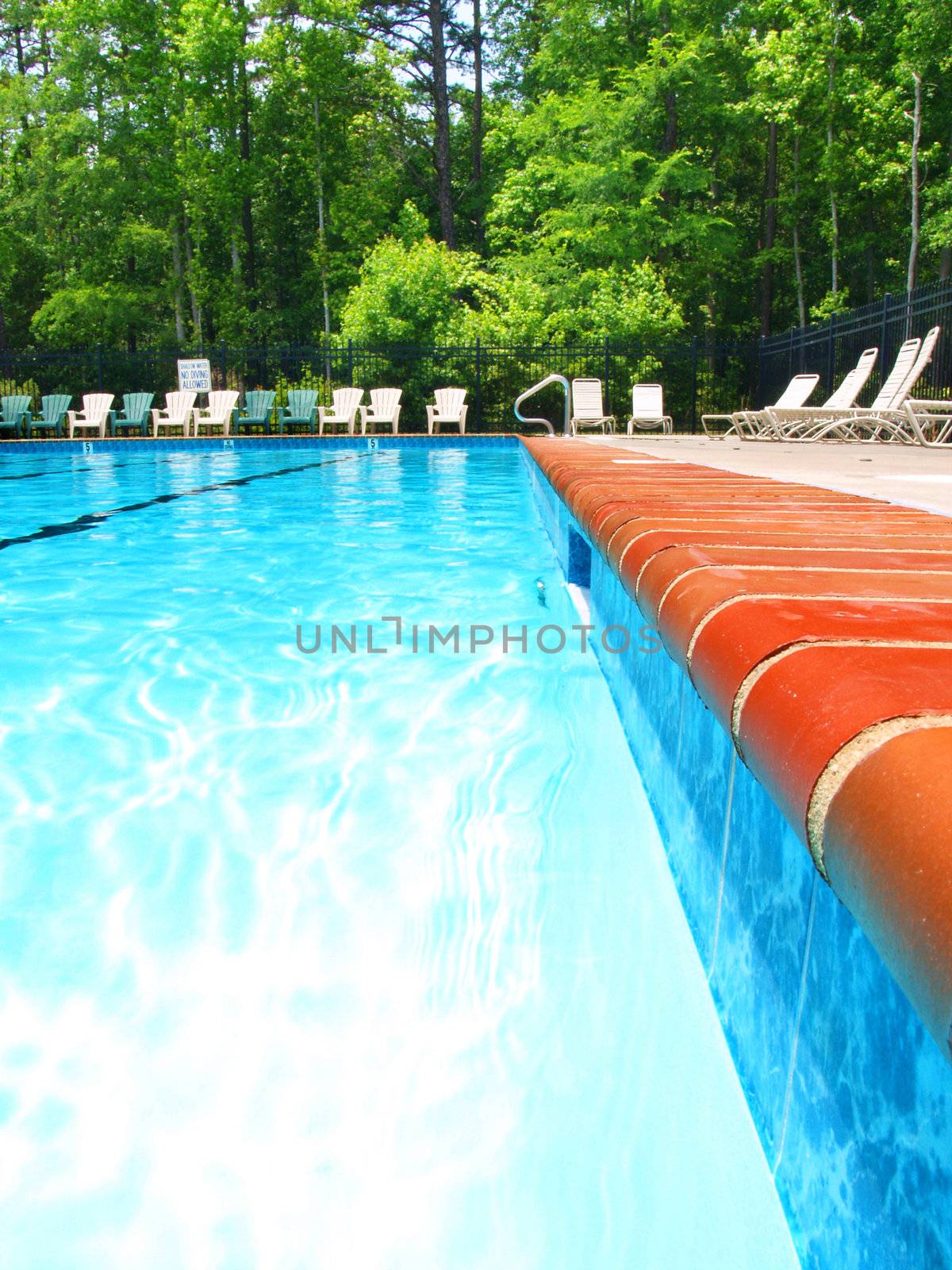 View along the edge of a large swimming pool