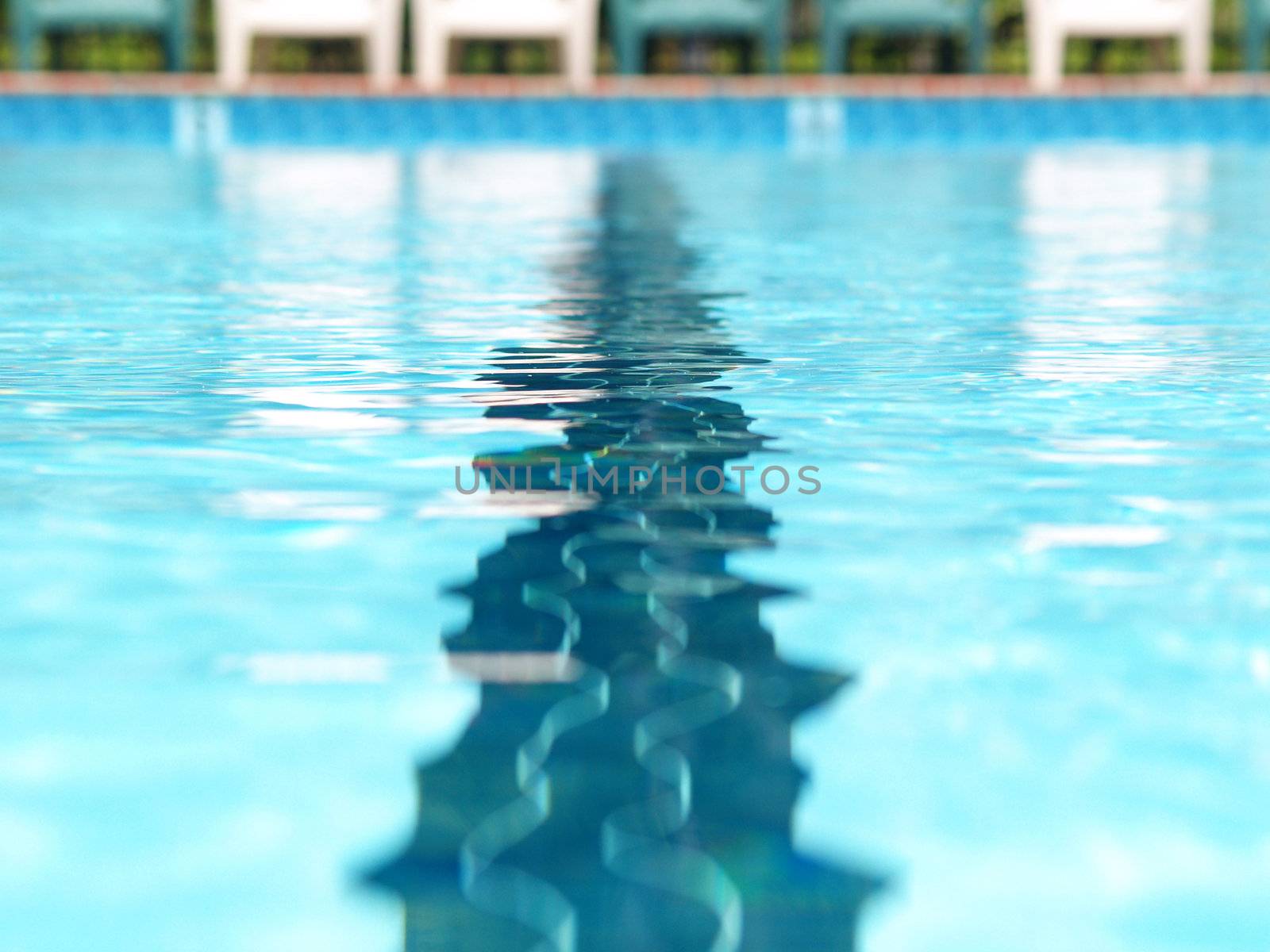 Closeup of the distortions of a swimming lane marker in a pool  