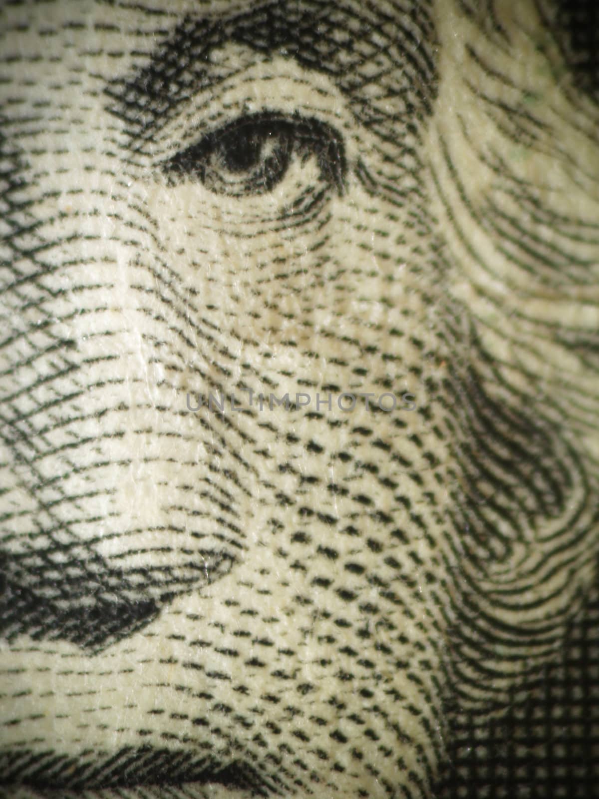 Macro of Washington's face on a dollar bill