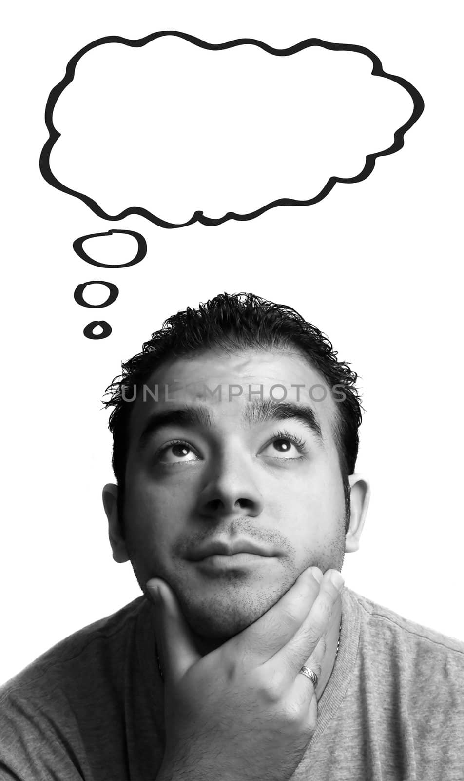 A man with his hand on his chin thinks deeply about something. Blank thought bubble above for your text or image.