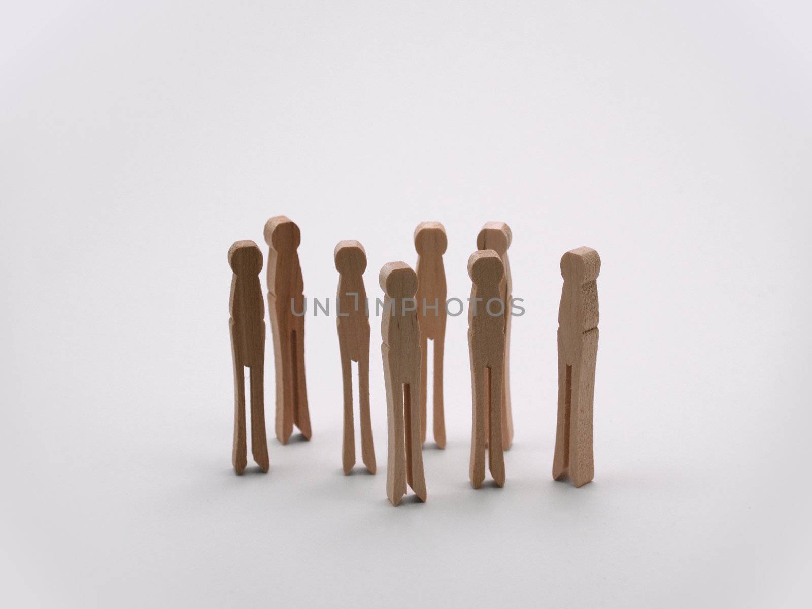 A bunch of clothespins standing in a group
