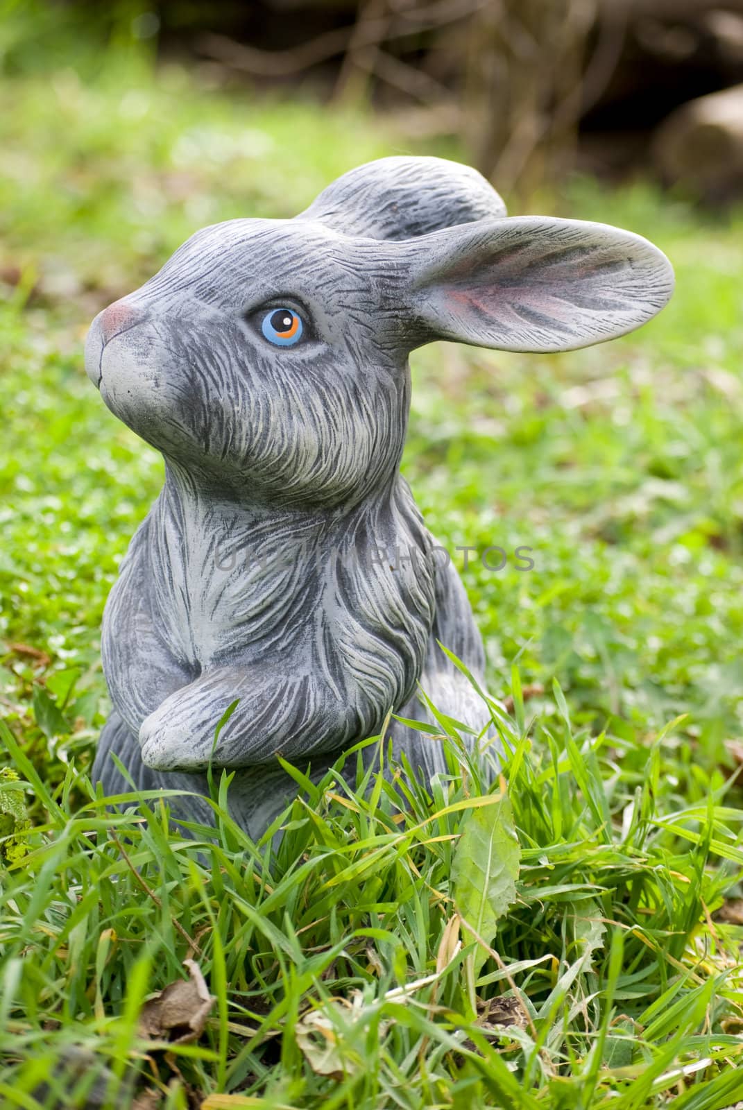 rabbit statue on green grass backgound