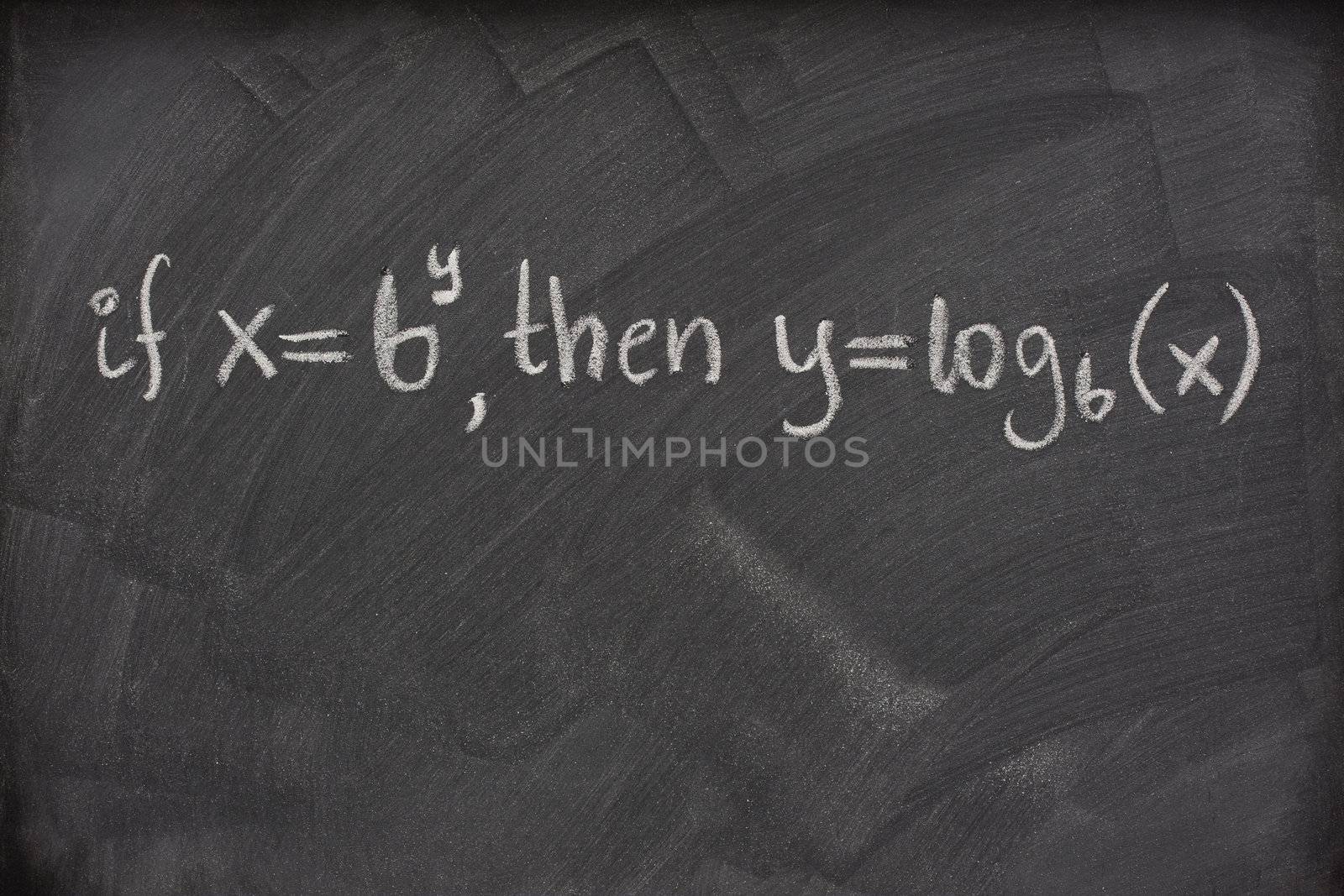 logarithm definition handwritten with white chalk on a school blackboard with eraser smudges
