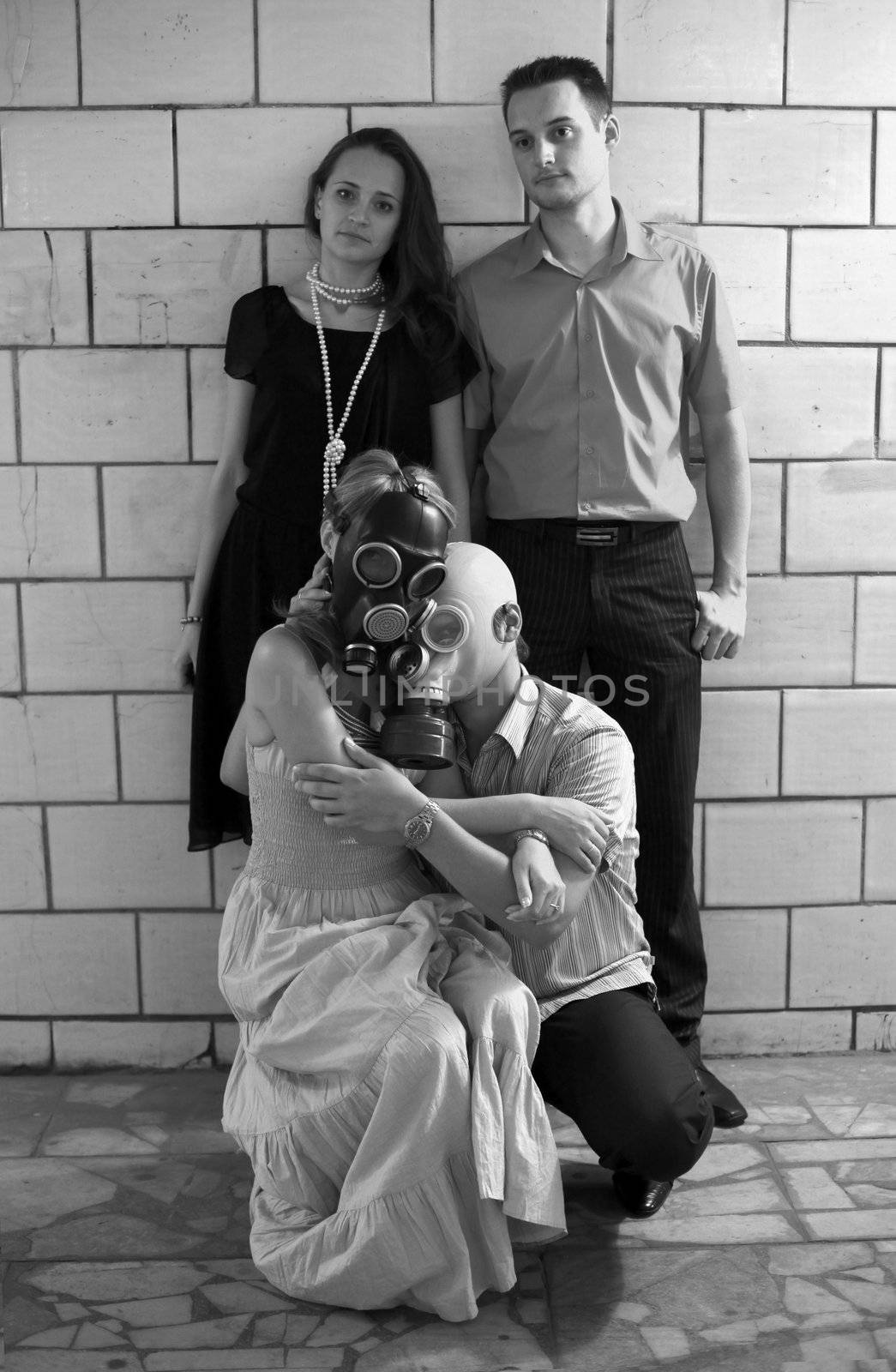 Two married couples in a tunnel, one of pairs in gas masks