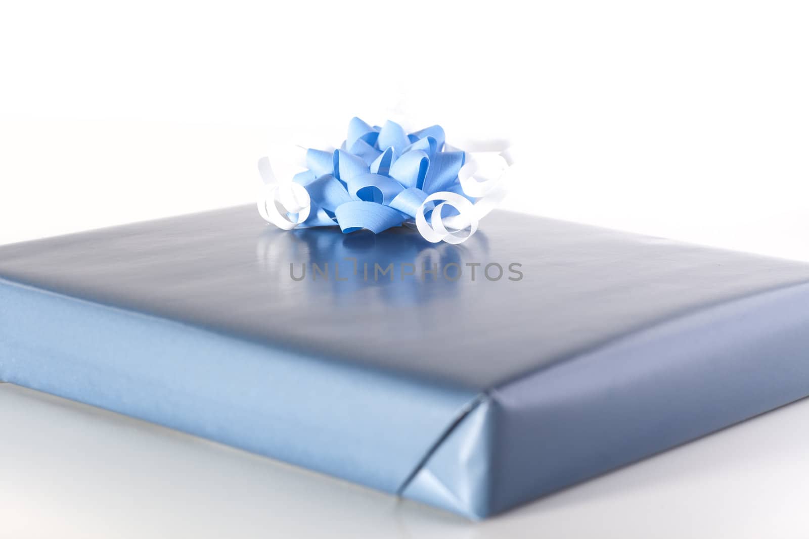 Blue gift with blue and white ribbons.