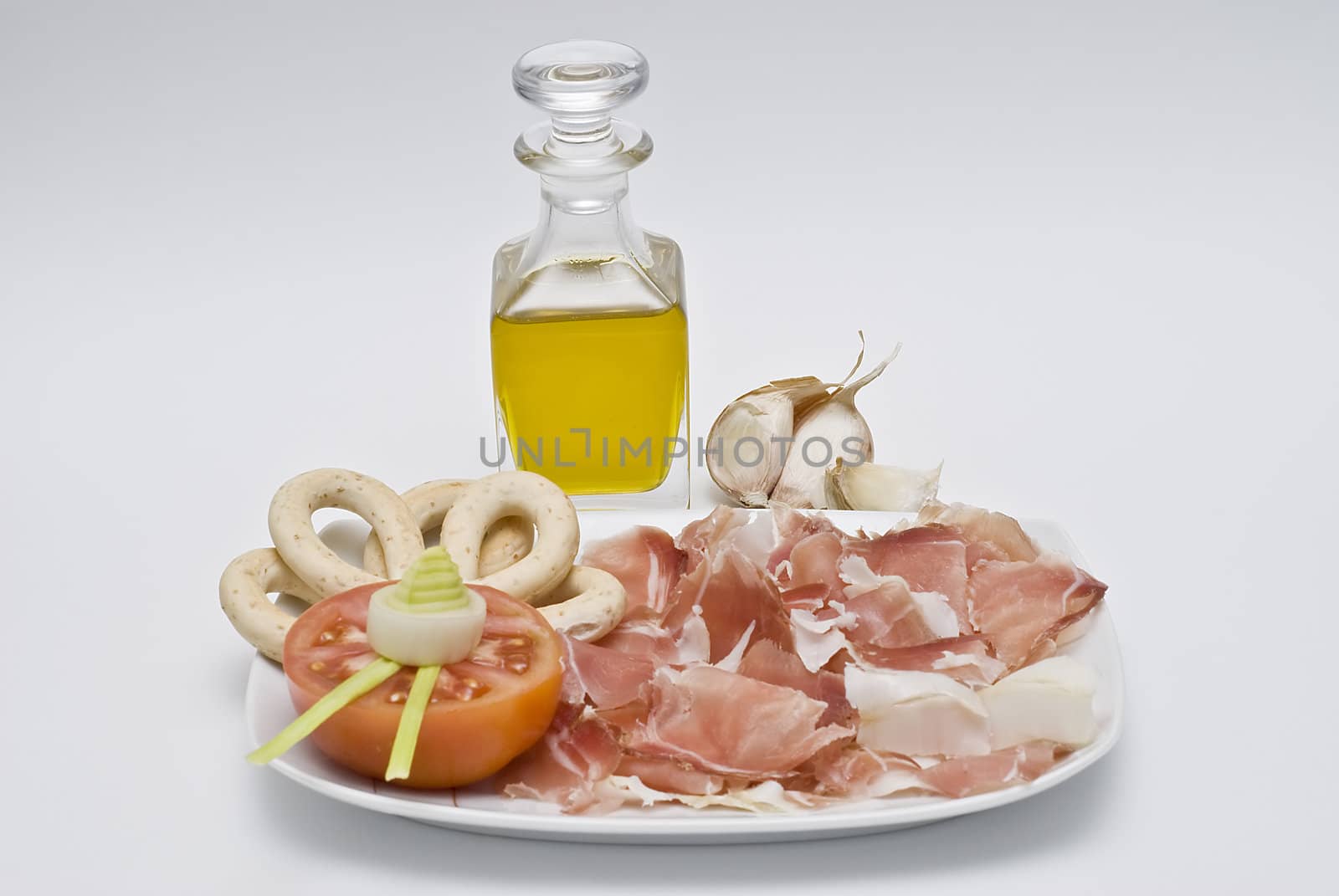 A plate of ham isolated on a white background.