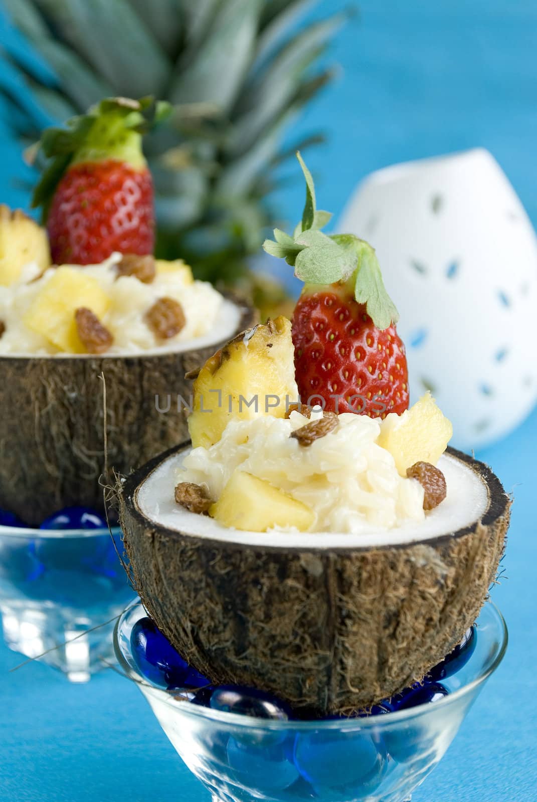 Coconut rice pudding with pineapple and strawberries