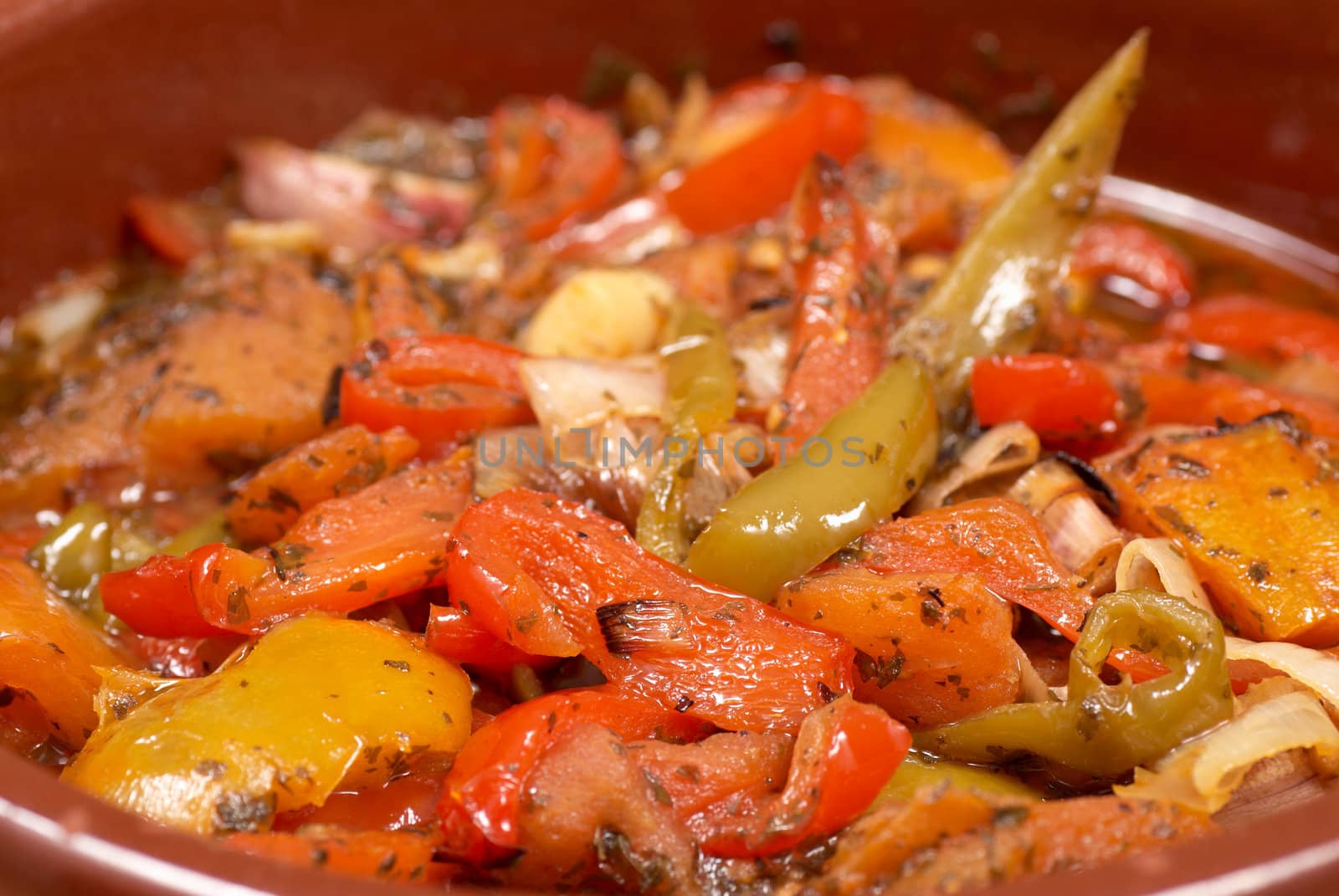 Pisto, traditional Spanish poached vegetables in a clay pot