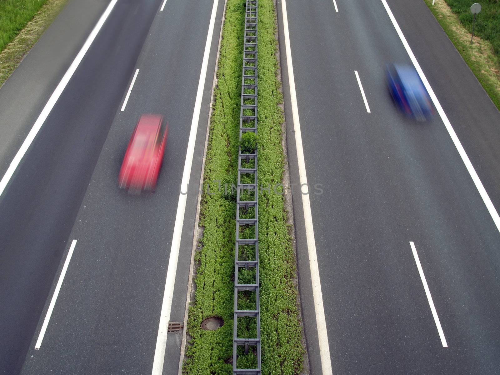 Two cars driving on the German autobahn
