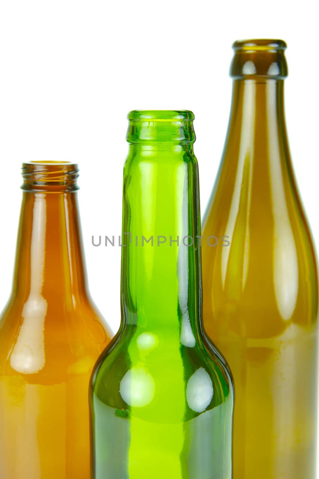 Empty beer bottles isolated against a white background