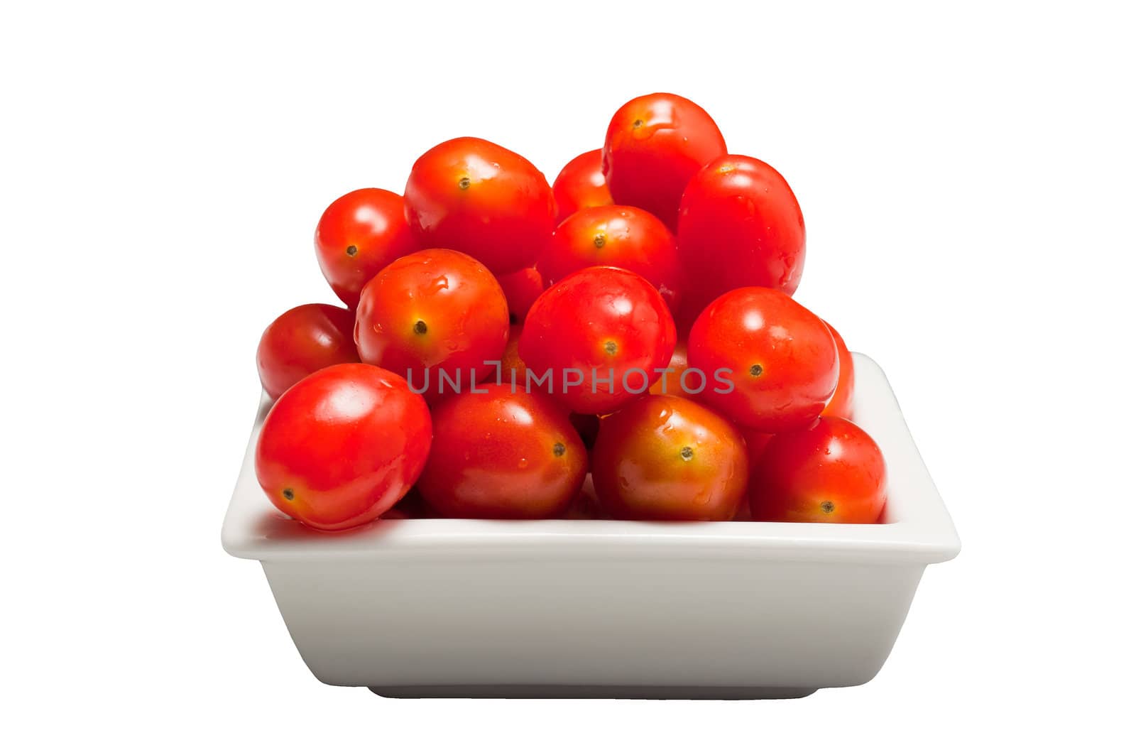 Fresh cherry tomatoes in a white bowl, isolated on white