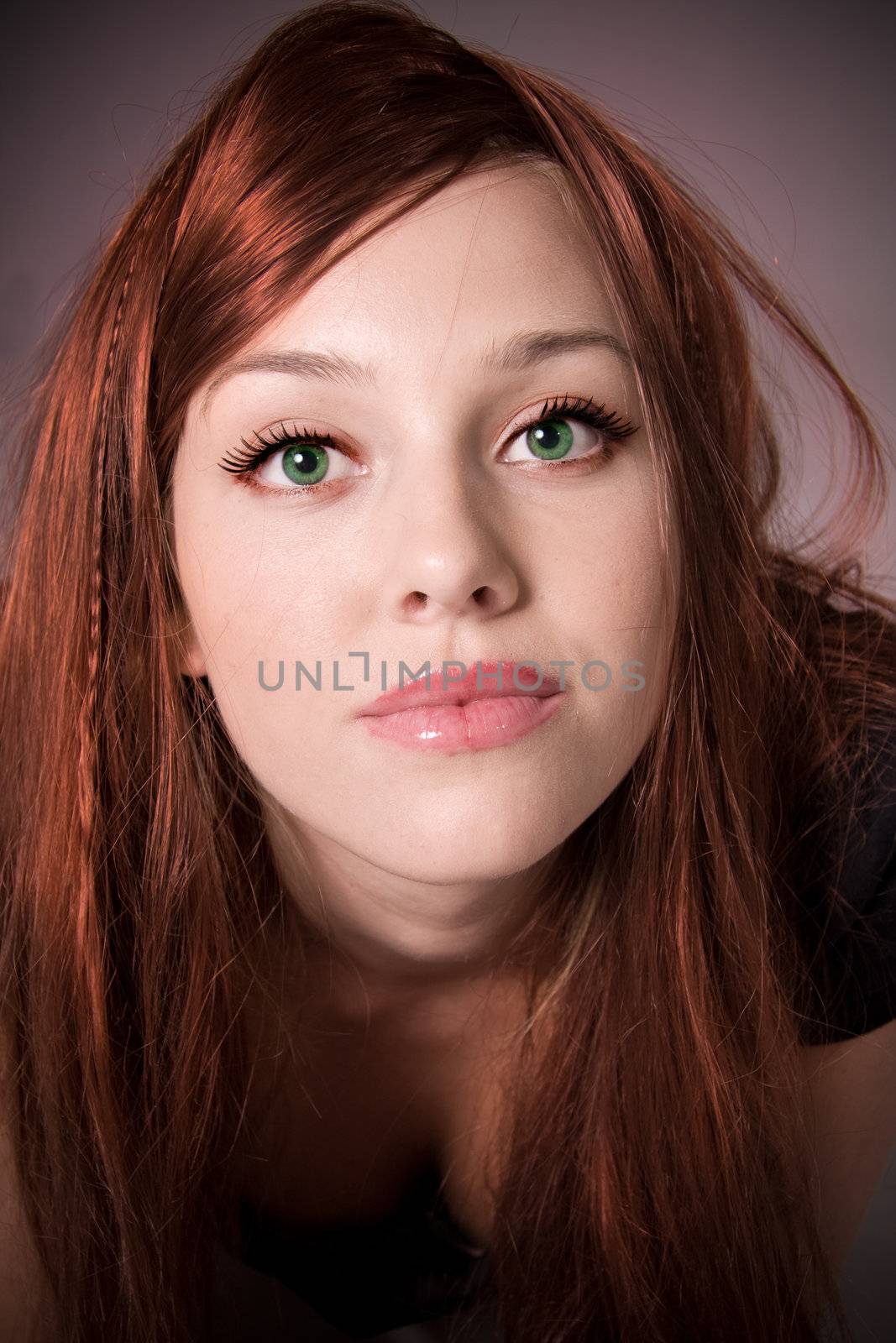 Beautiful young woman with red hair