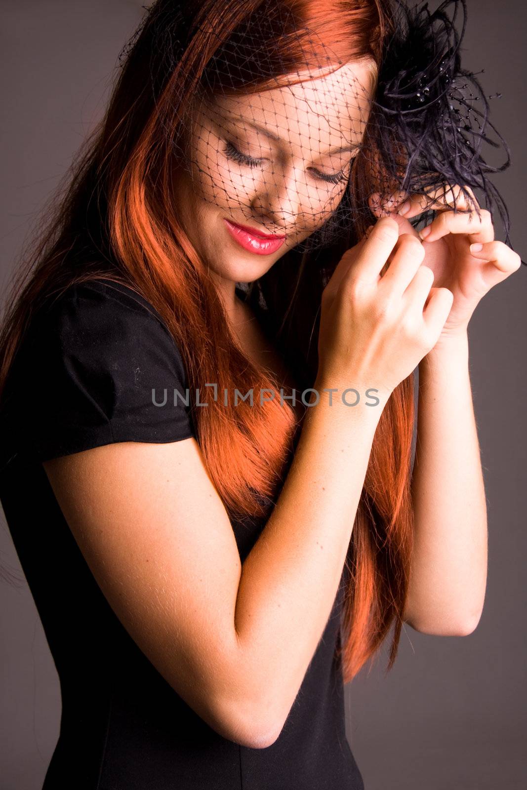 Beautiful young woman with red hair