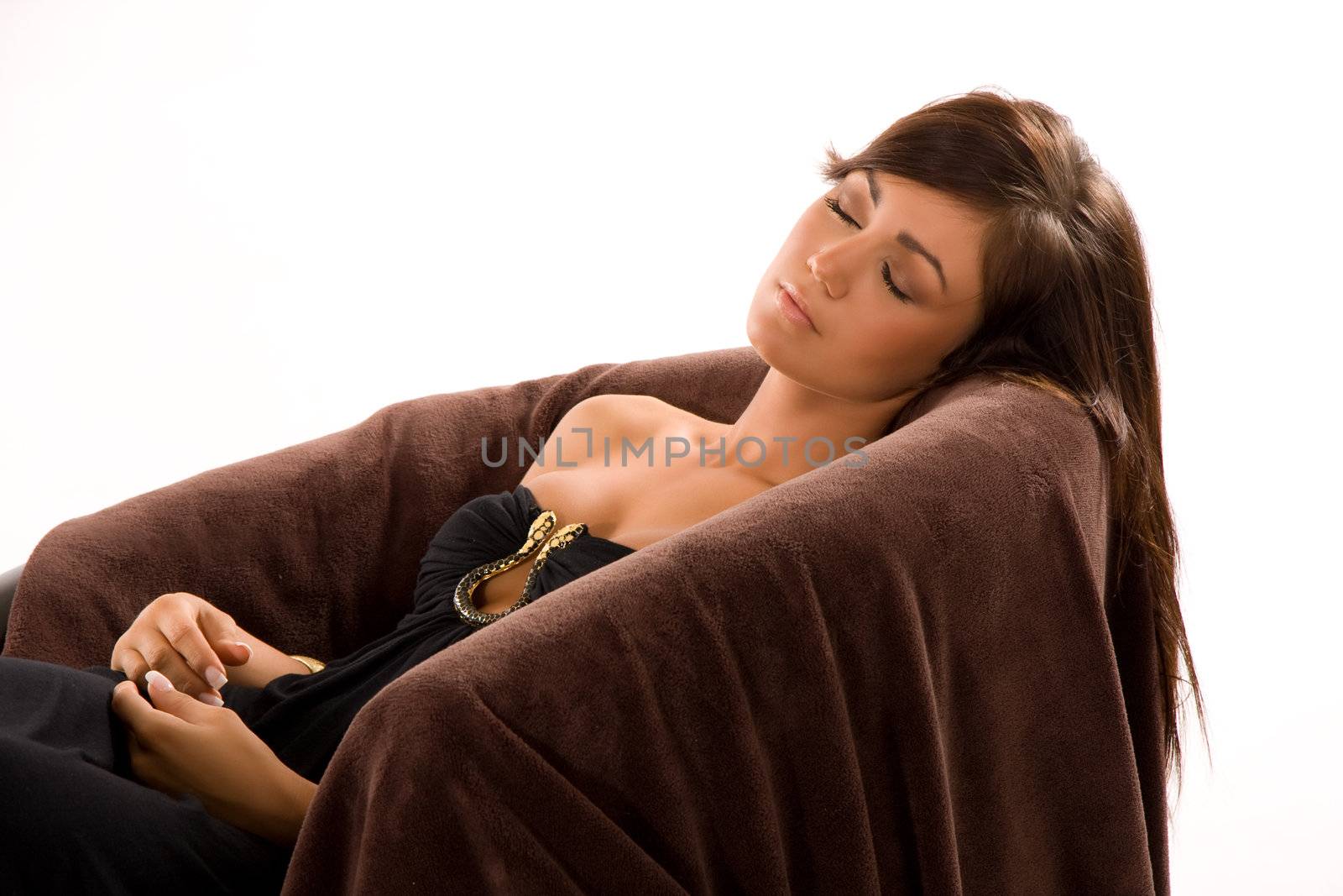 Beautiful young woman resting on a sofa