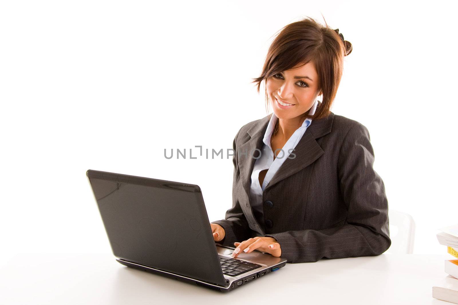 Young business student typing on a laptop