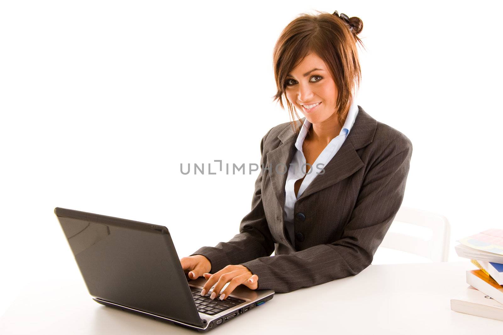 Young business student typing on a laptop