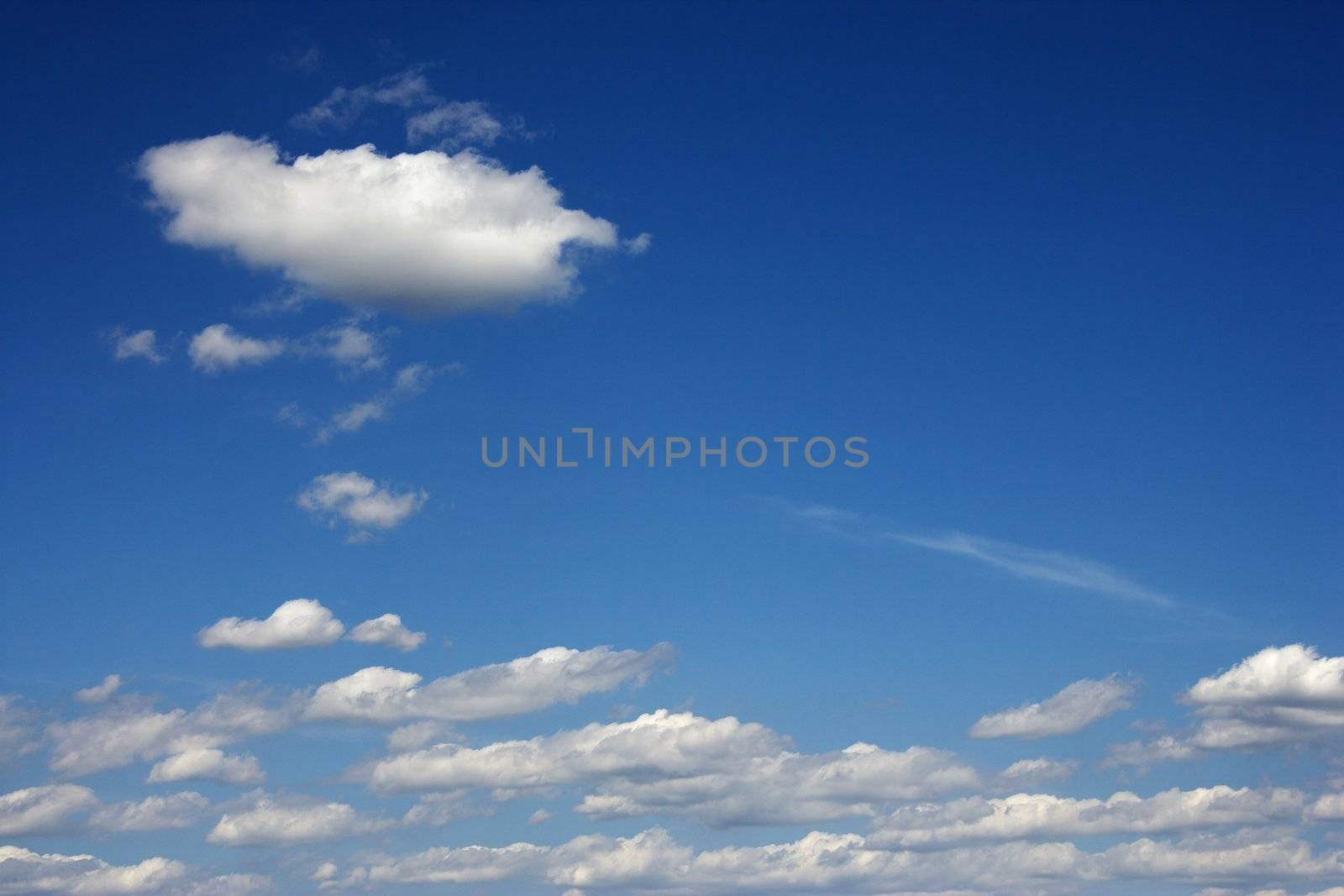 Peaceful clouds in blue sky.