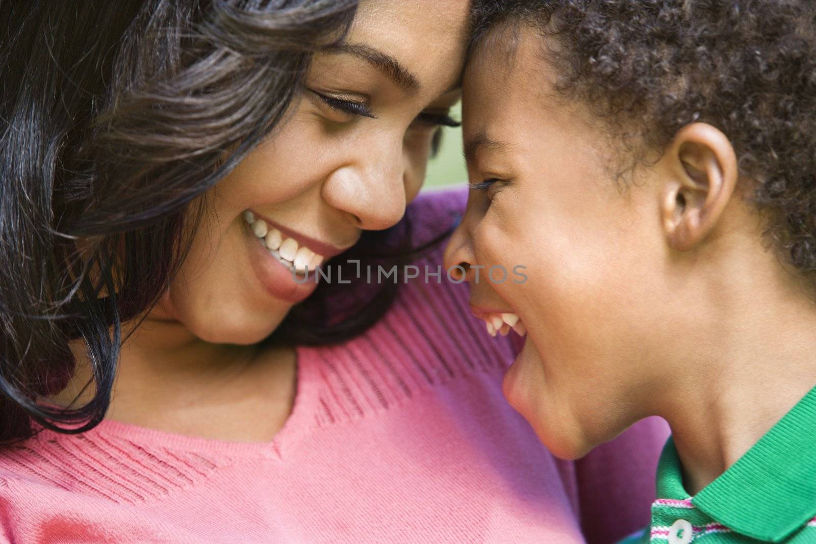 Close up of happy smiling mother and young son.