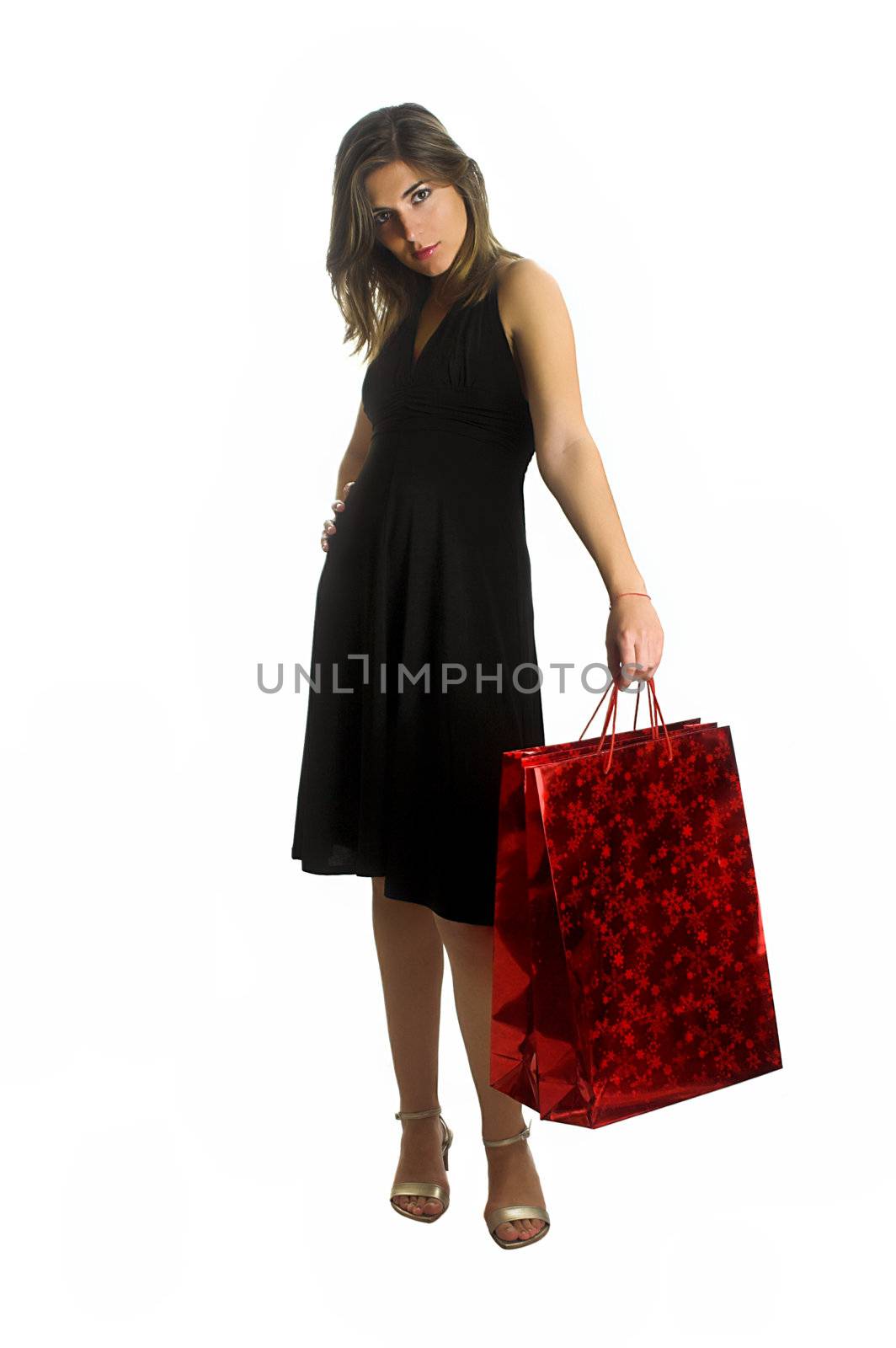Beautiful woman isolated on a white background with a bag on the left hand.