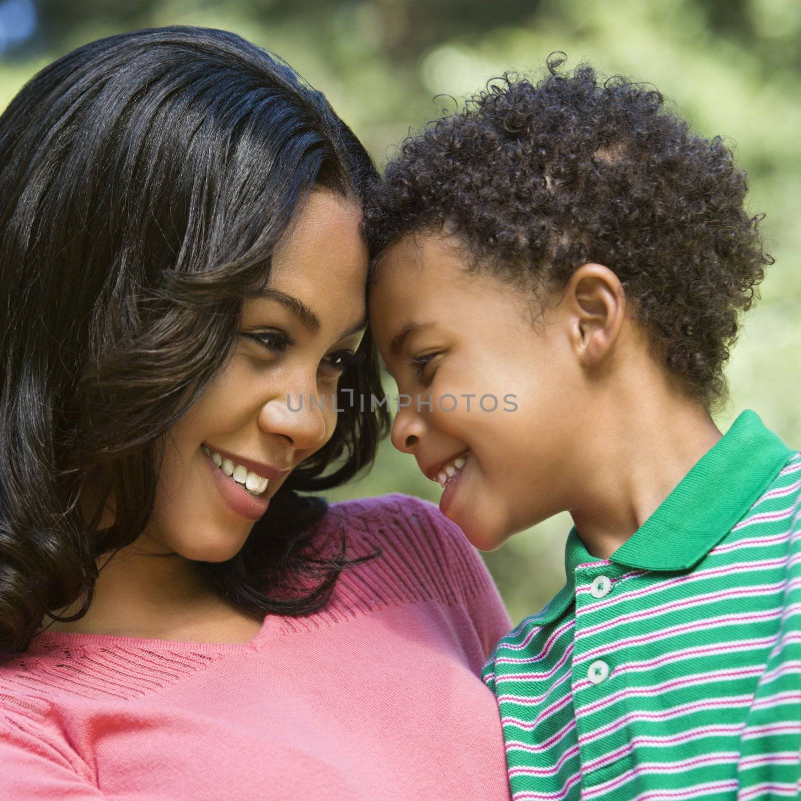 Happy smiling mother and young son portrait.