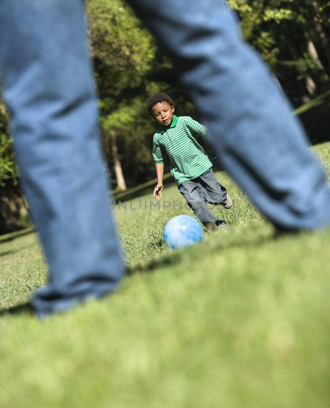 Father and son playing. by iofoto