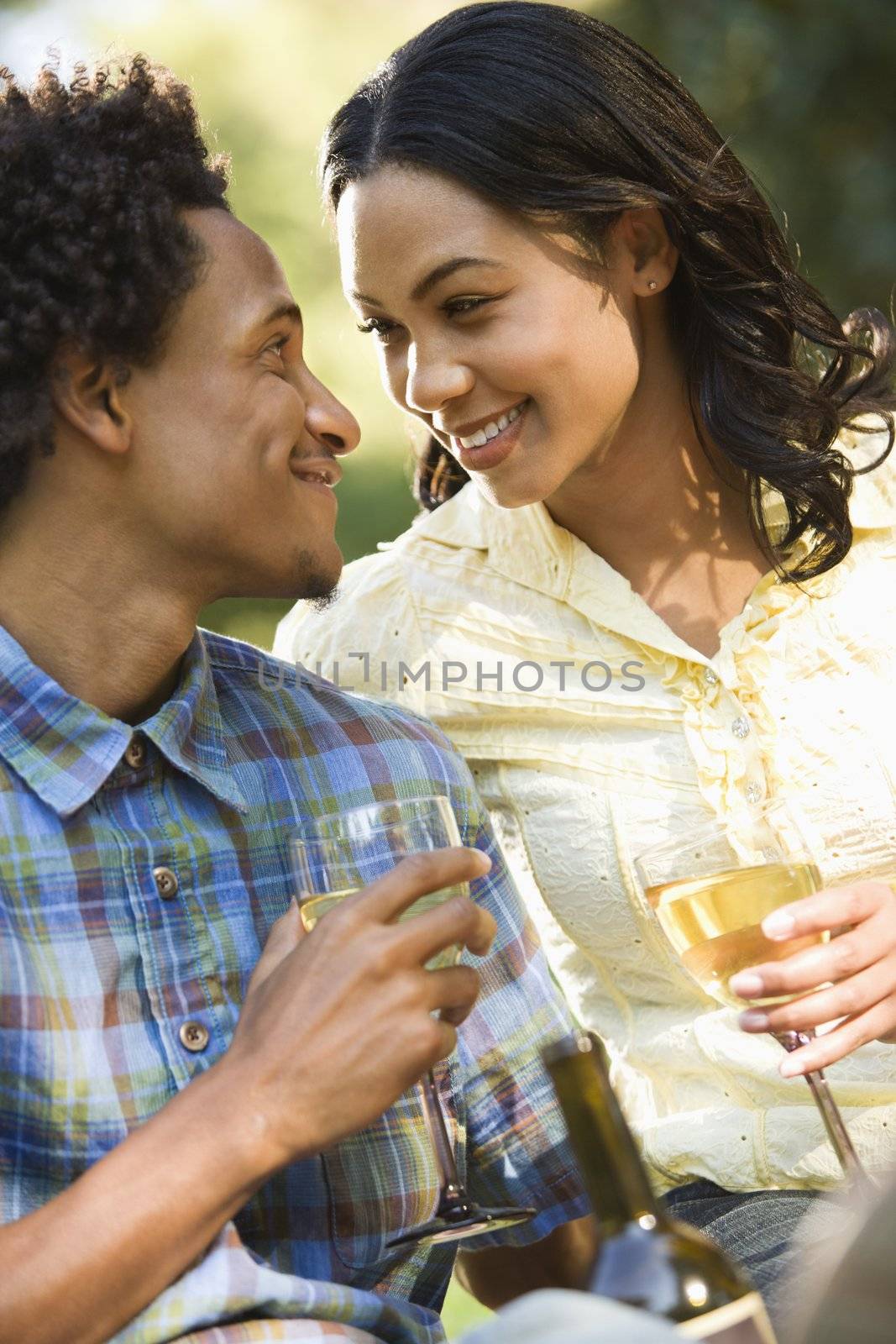 Couple having wine. by iofoto